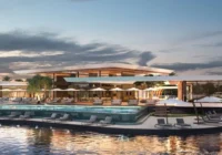 Área de lazer com piscina à beira do lago ao entardecer — Condomínio Royal Lake